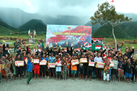 Semangat Nasionalisme Berkibar di Perbatasan Papua Tengah.(Foto:Dok. Satgas Yonif 112/DJ